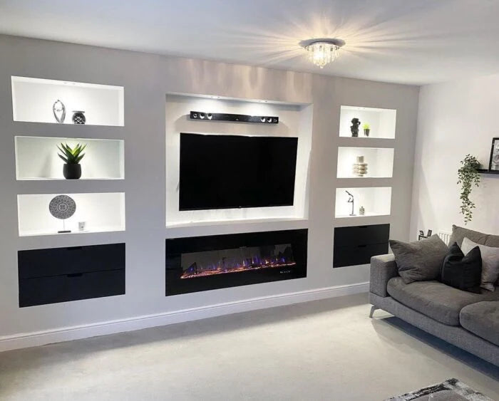 wall mounted tv in living room with built in electric fire underneath